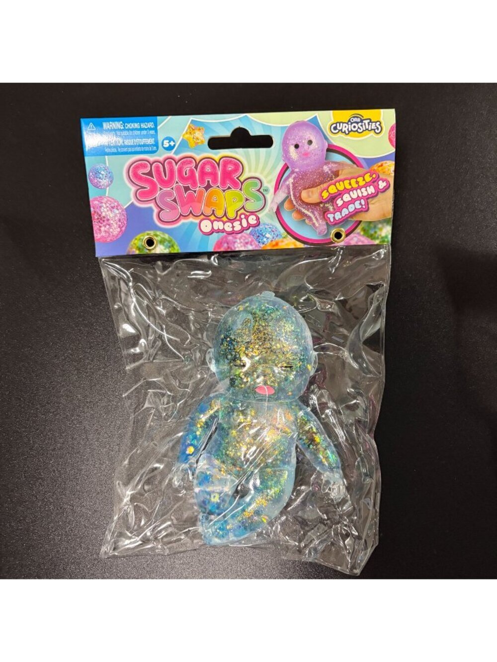 ORB Curiosities Sugar Swaps Onesie Glitter Blue Baby Squishy Toy New Sealed